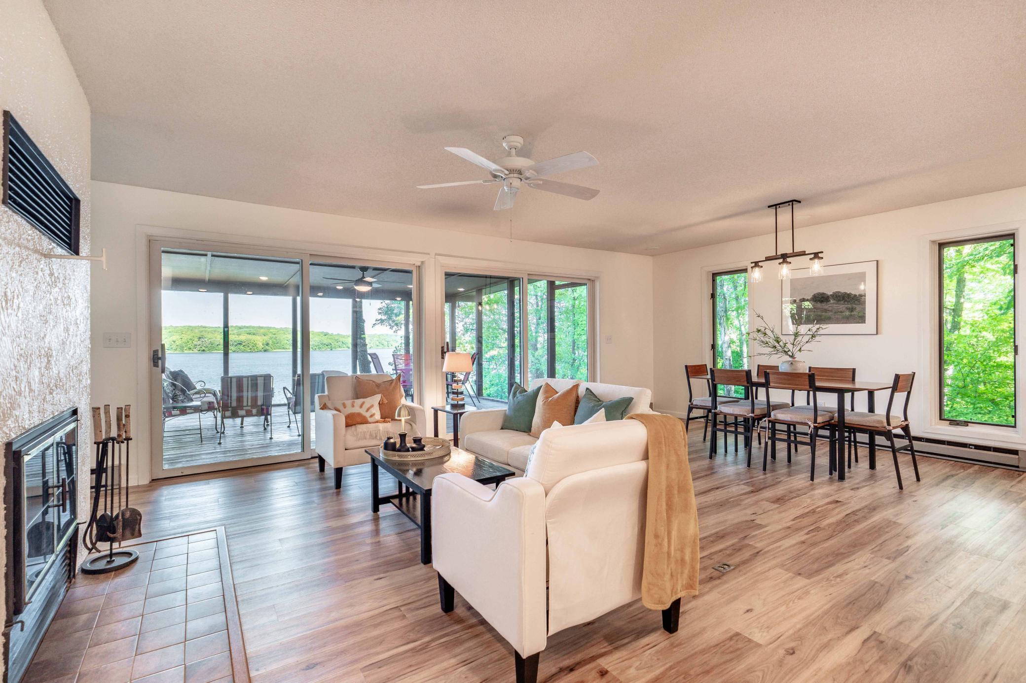 Views from nearly every angle are to the lake. This wood burning fireplace is dual sided to the adjacent 2nd living room.