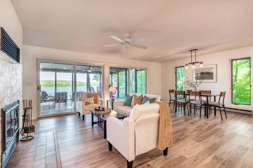 Views from nearly every angle are to the lake. This wood burning fireplace is dual sided to the adjacent 2nd living room.