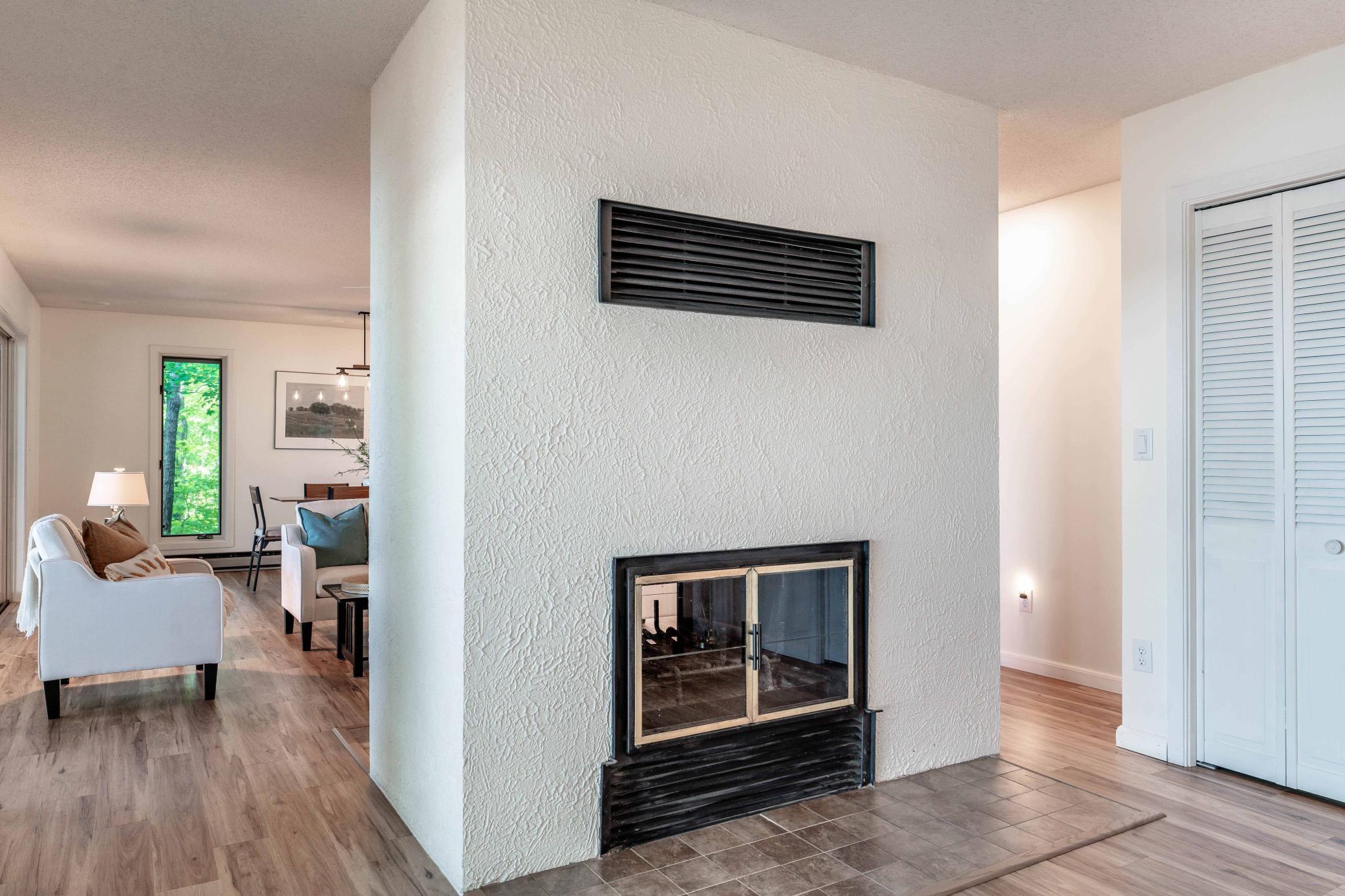 Detail on the fireplace includes a operable fan to warm the whole area