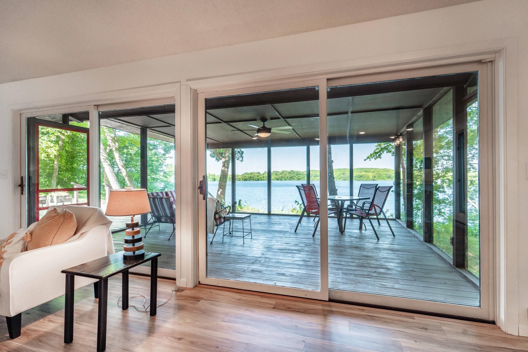 One of the 4 sets of large patio sliding glass doors. Two venture to the screen porch and two to the deck.