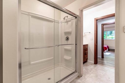Updated shower enclosure with glass doors