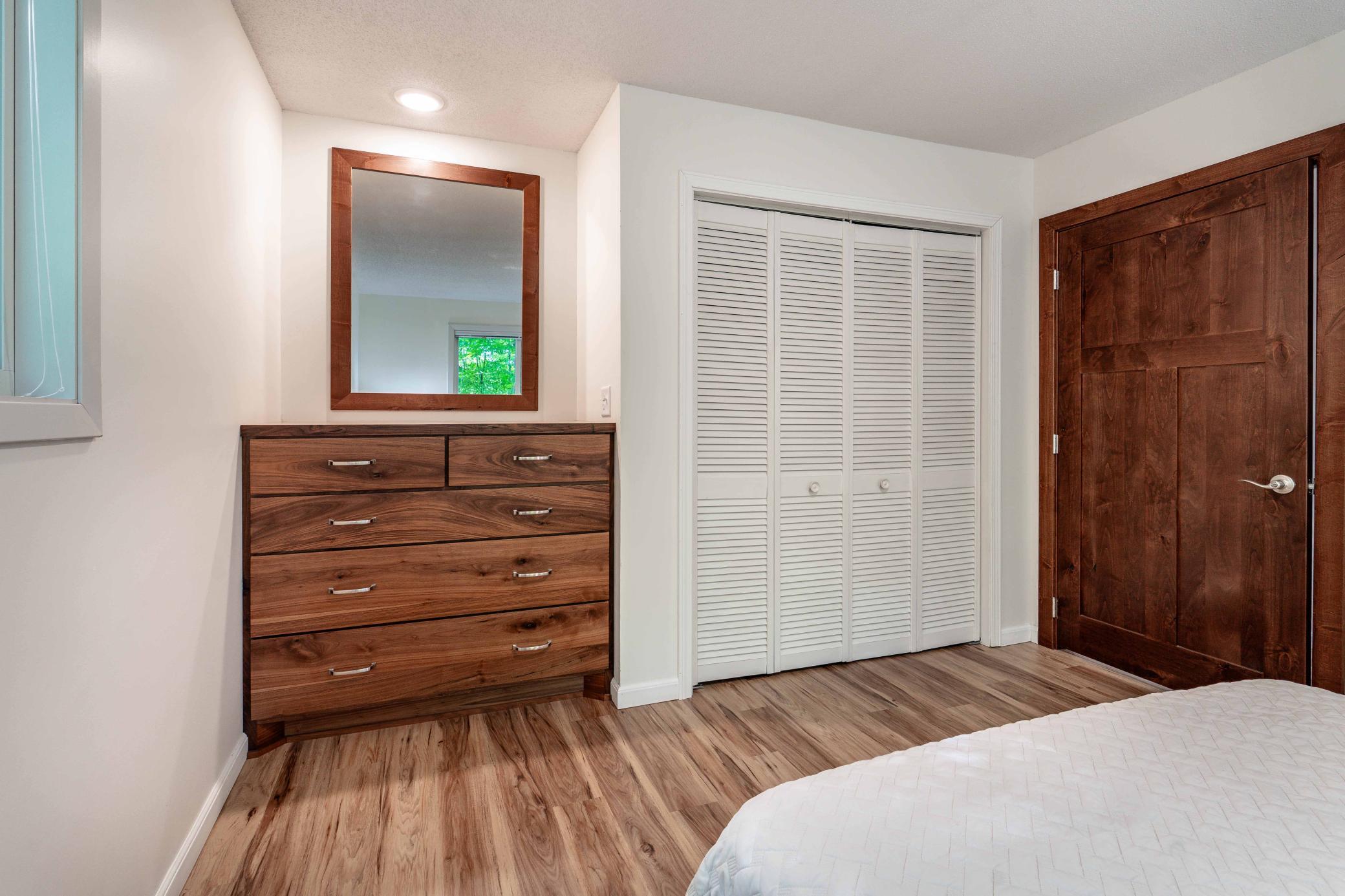 Custom built in dresser. Notice 3 panels solid doors throughout the home