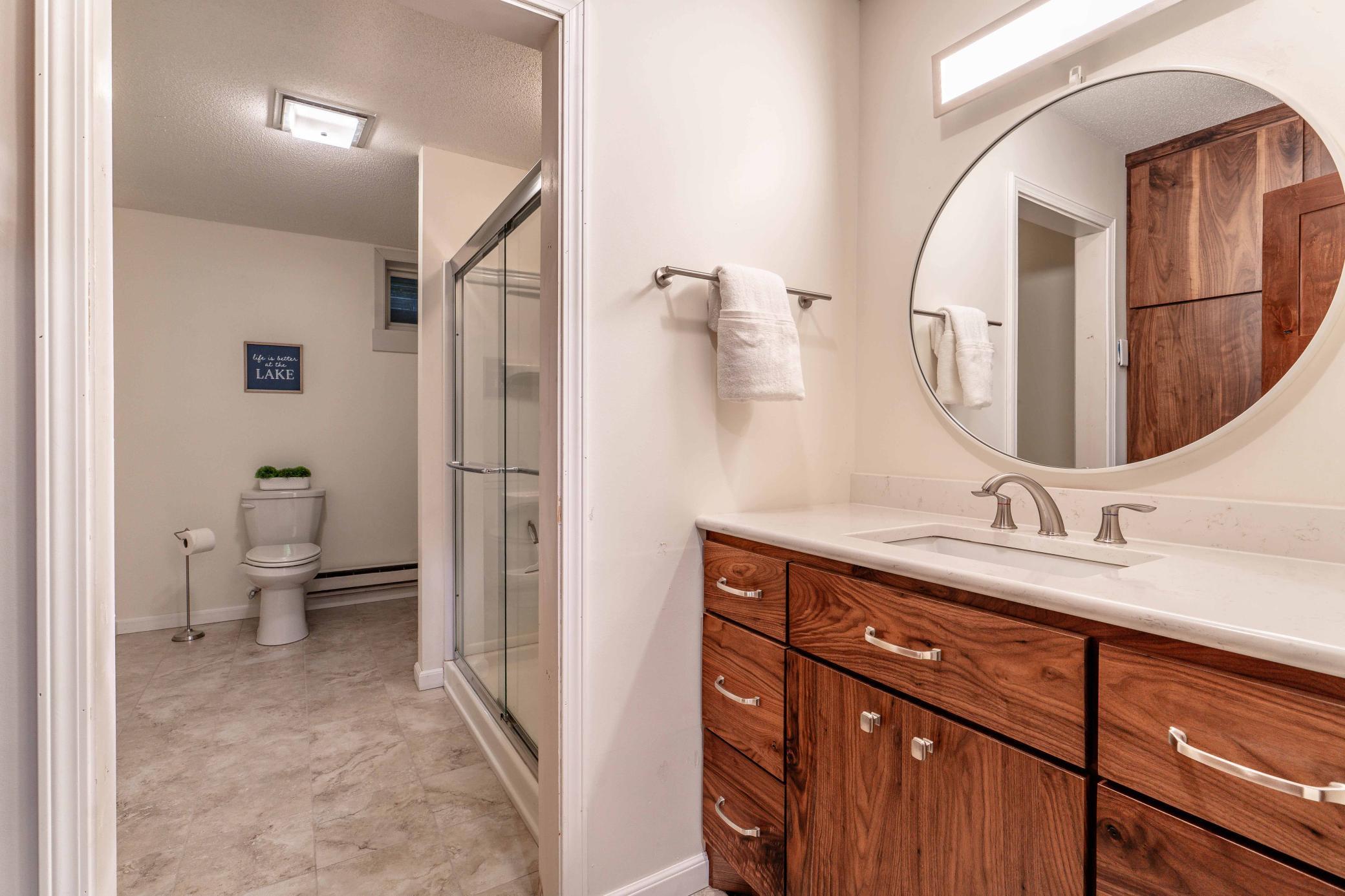 Lower Level bath complete with tile floor and custom vanity