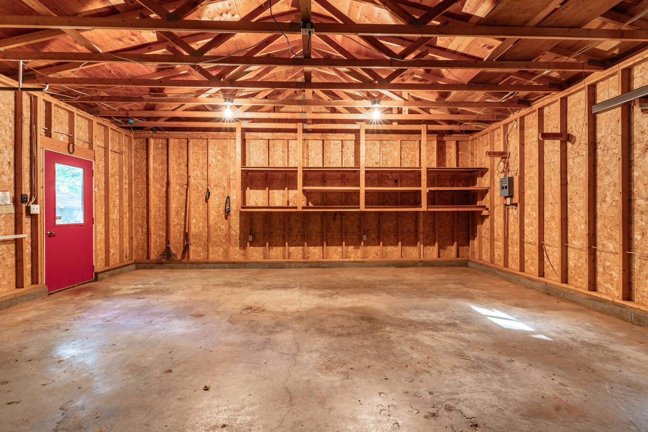Garage interior with built in shelving for optimal storage of your lake toys