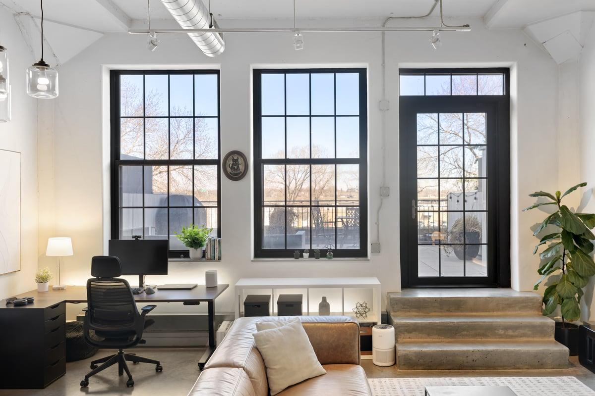 Wall of windows for natural light and access to the Terrace