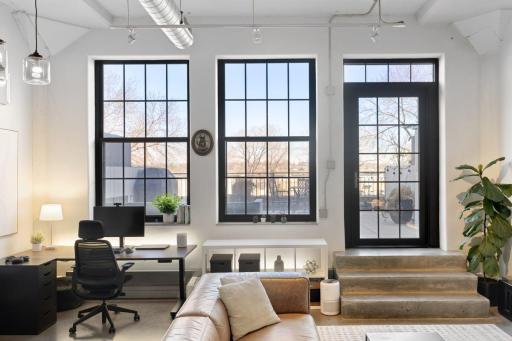 Wall of windows for natural light and access to the Terrace