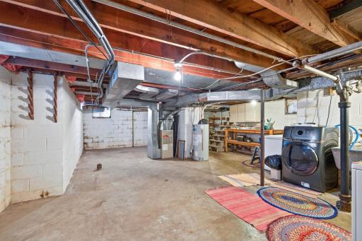 Unfinished Basement has Plenty of Storage and New Washer/Dryer Combo Unit