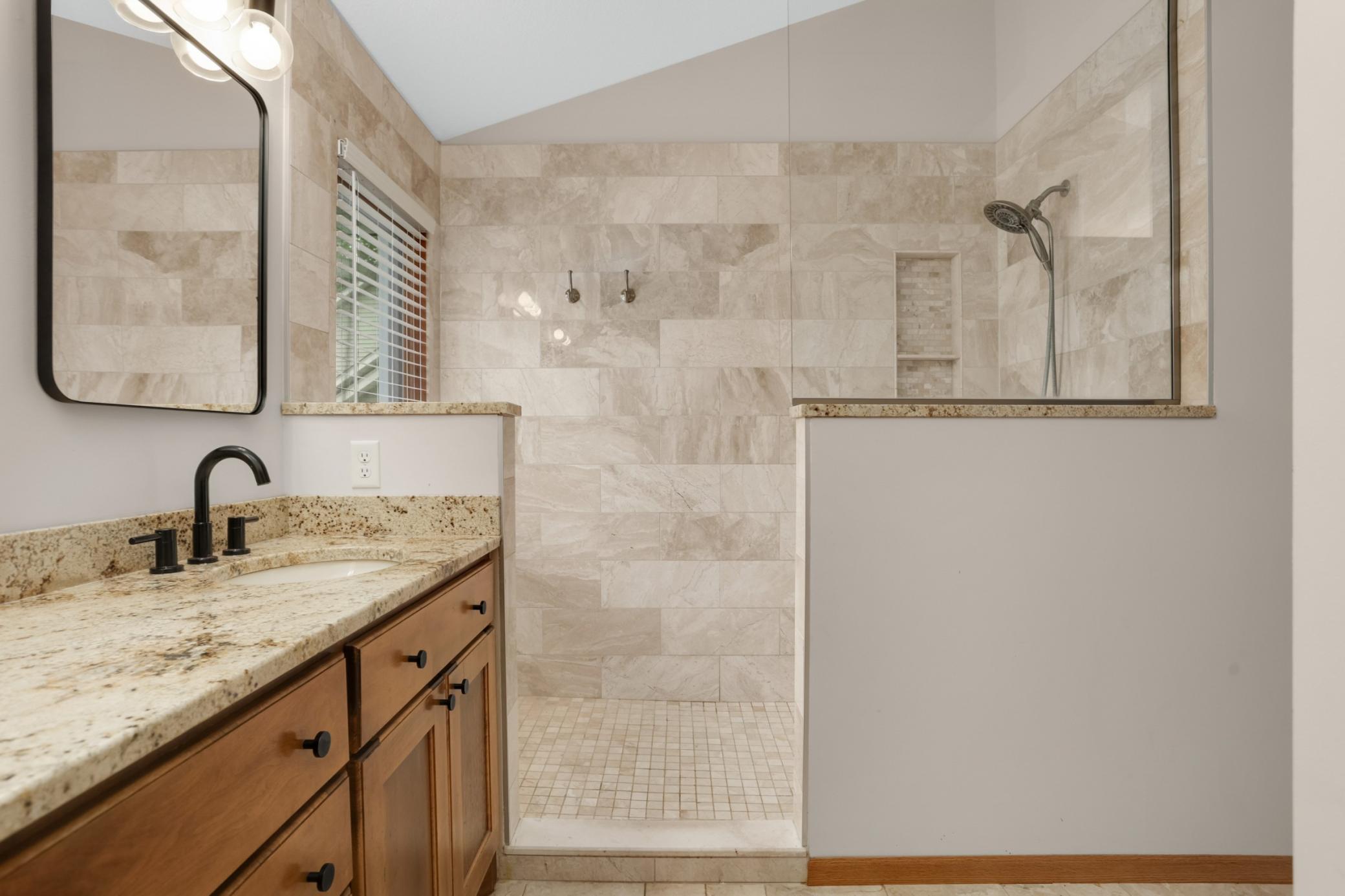 Incredible walk-in shower and walk thru to large closet.