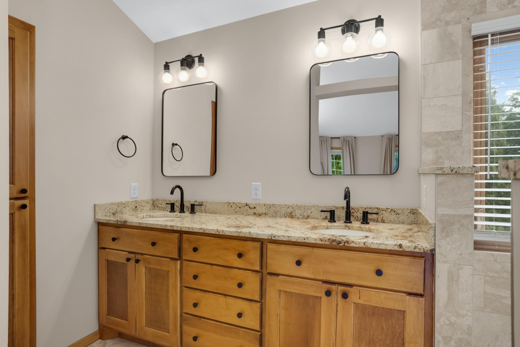 Private owner's bath with dual vanities.