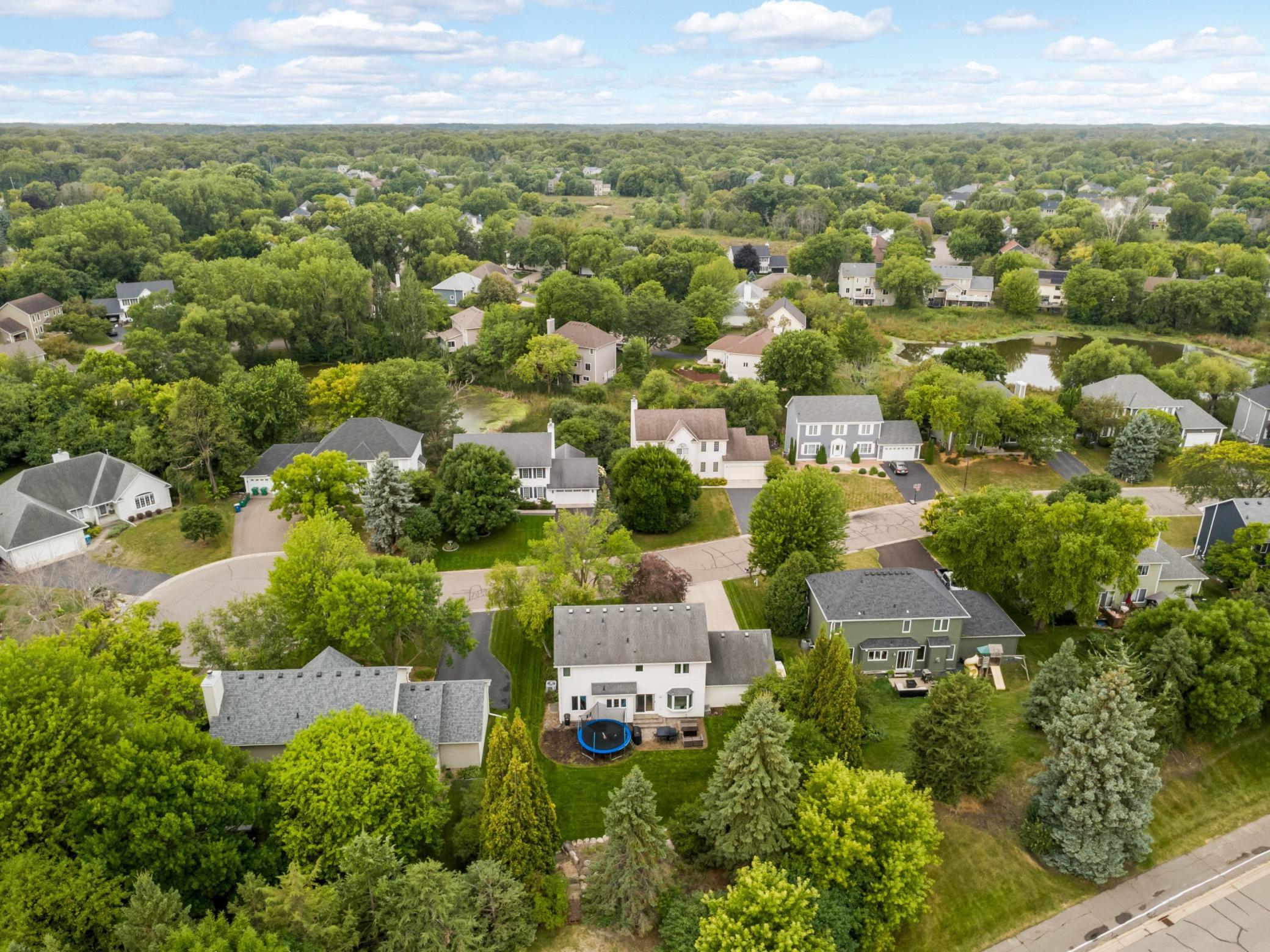 This home sits on a lot with mature trees in the heart of Plymouth