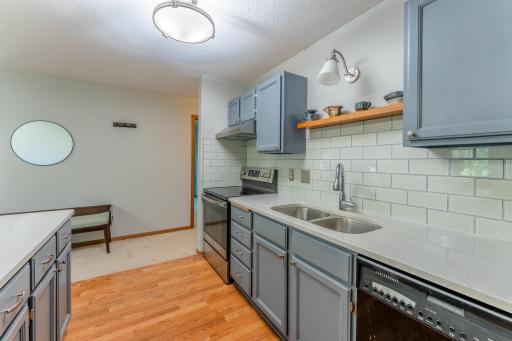 Updated countertops, backsplash and lighting.