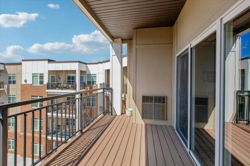 The generously sized balcony offers a wonderful outdoor retreat with views of the surrounding community.