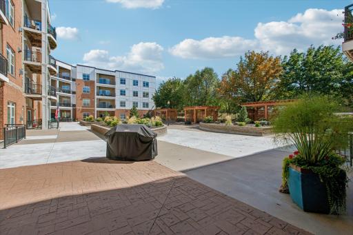 The thoughtfully designed grounds offer inviting spaces to enjoy fresh air, sunshine, and maybe a little BBQ