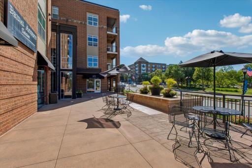 A charming patio and nearby coffee shop bring a touch of neighborhood-style living right to your doorstep.