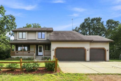 This home features an inviting front porch, large 3-car garage, and abundant privacy framed by grand shade trees.