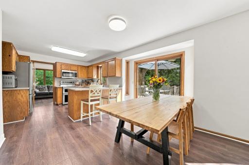 Spacious dining area with direct access to deck, perfect for entertaining.