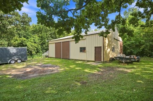 Enjoy this versatile 40x45 pole shed with 12' ceilings and 100-amp electrical service.