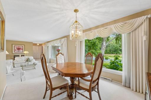 Main floor dining area with views of wooded park land across street.