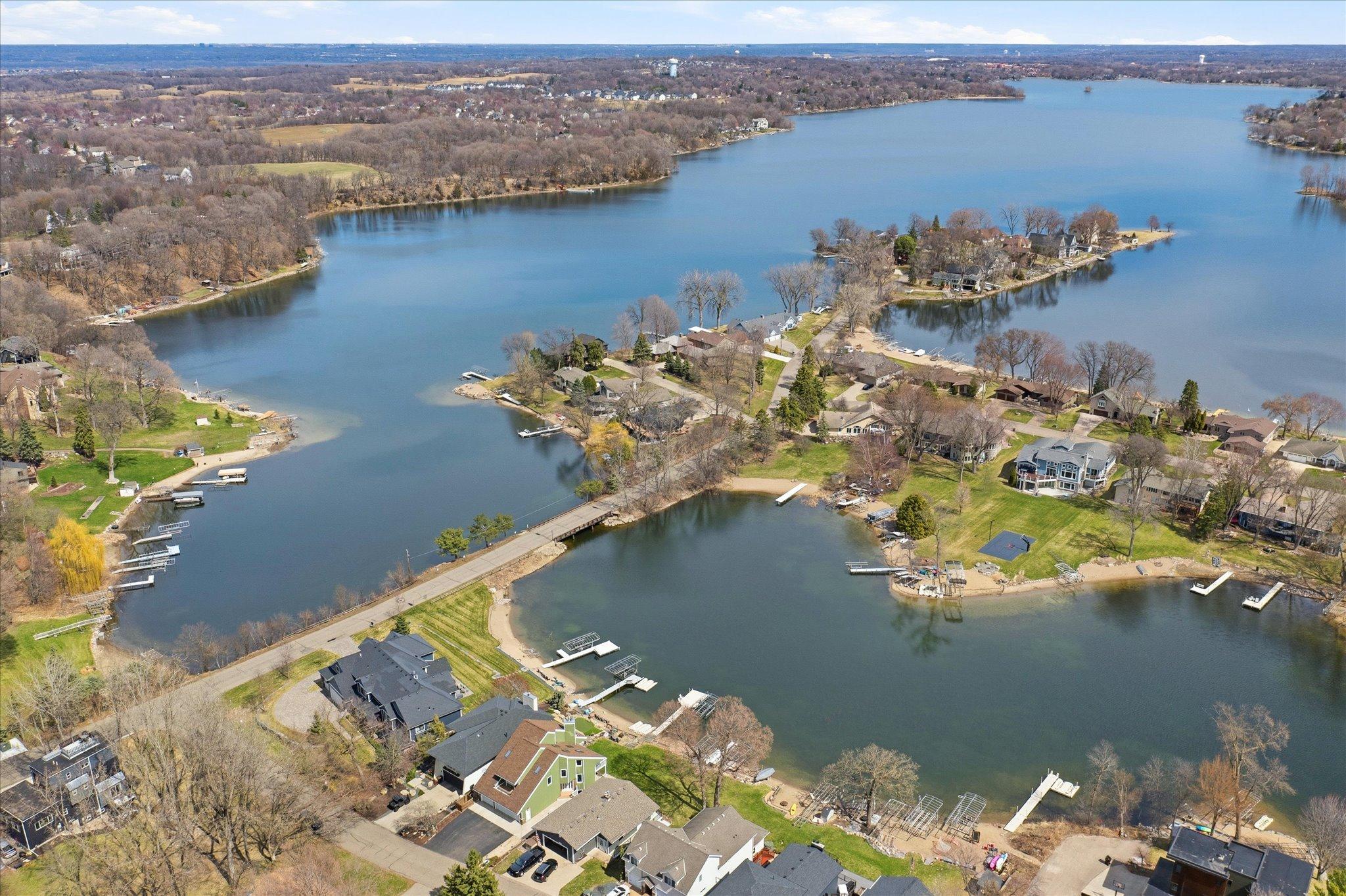 Aerial perspective highlighting the property's desirable lakefront setting and surrounding shoreline.
