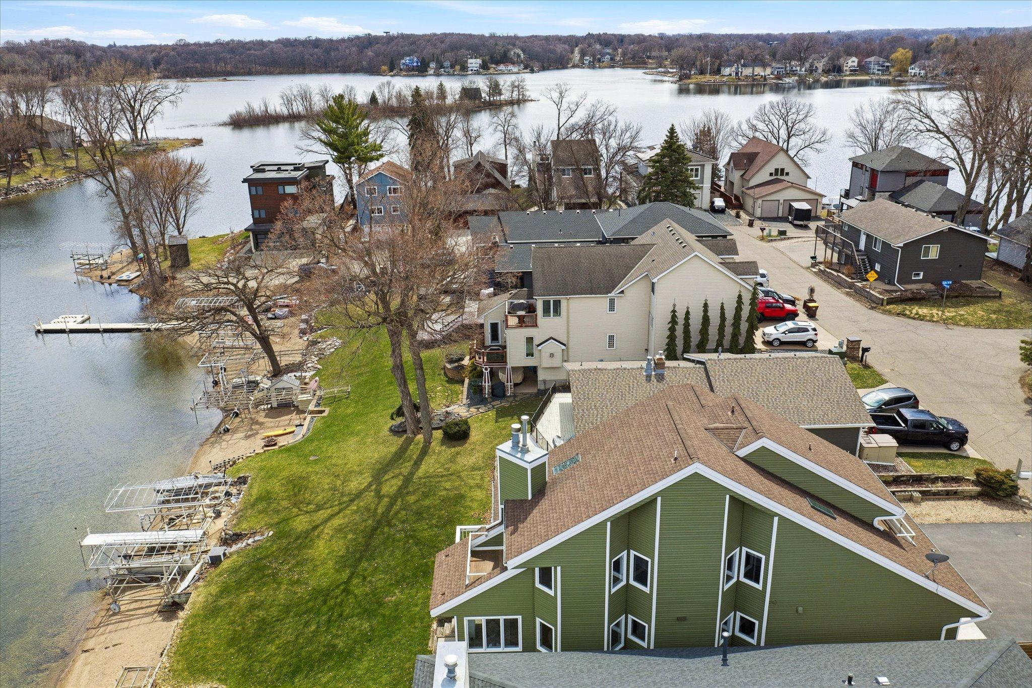 Neighborhood aerial highlighting the home's premier location on Lower Prior Lake.