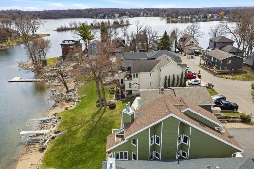 Neighborhood aerial highlighting the home's premier location on Lower Prior Lake.