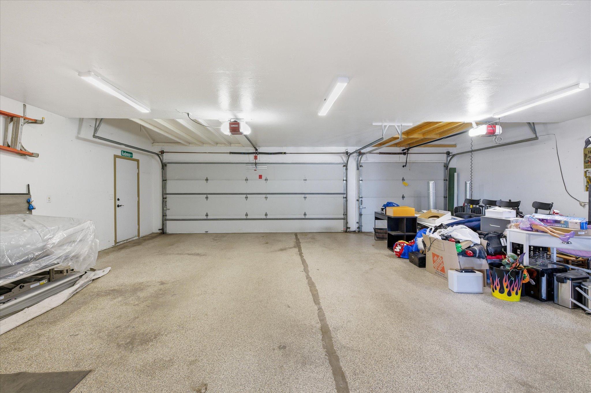 Heated three-car attached garage and oversized storage area.