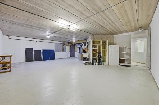 Spacious unfinished storage area offering abundant storage and workshop potential.