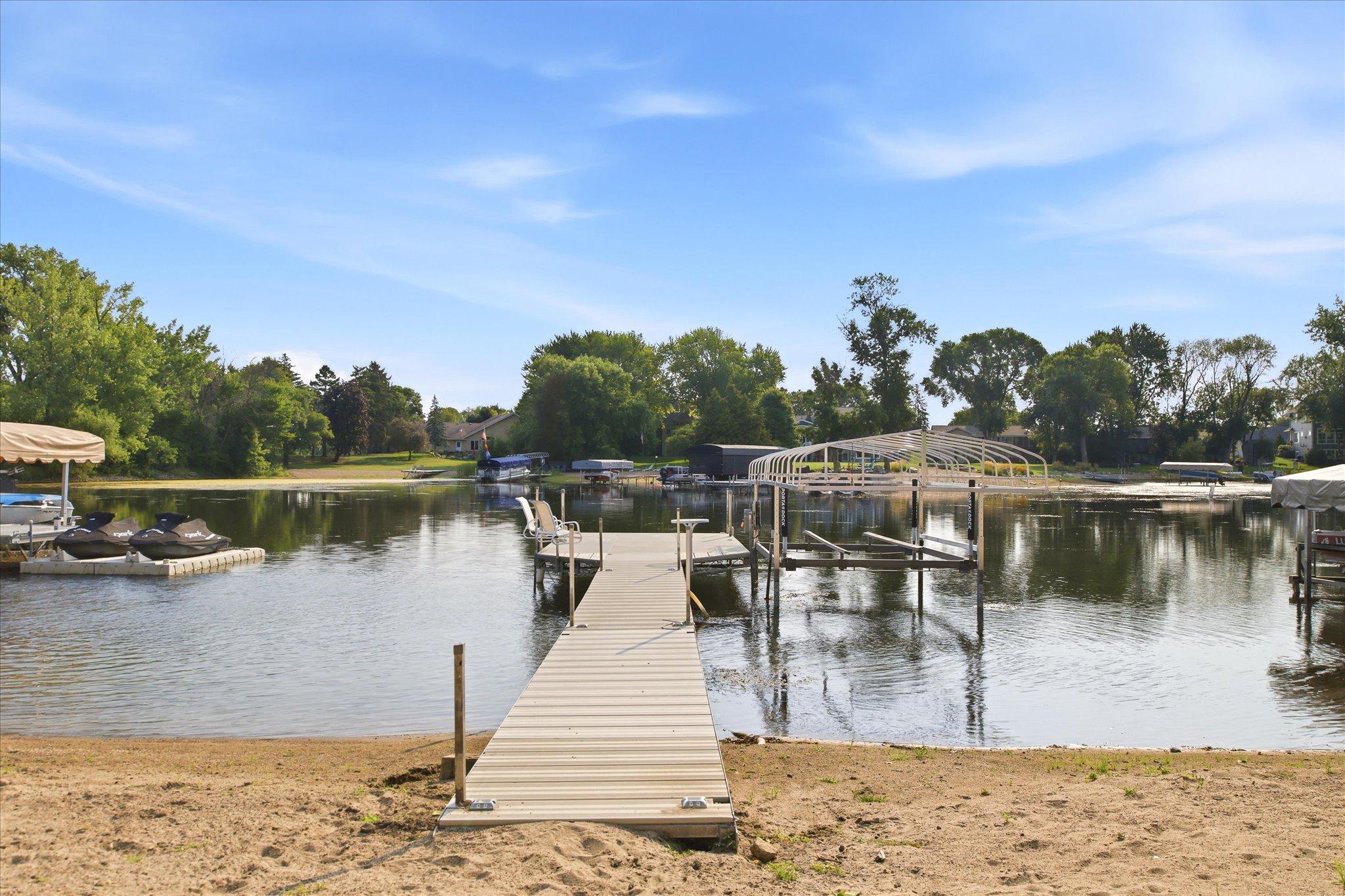 Private permanent dock included with sale providing direct access to the Lake.