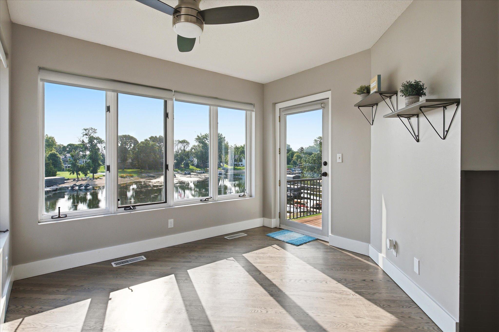 Flex space with expansive lake views with direct access to the elevated deck and newly installed railings.