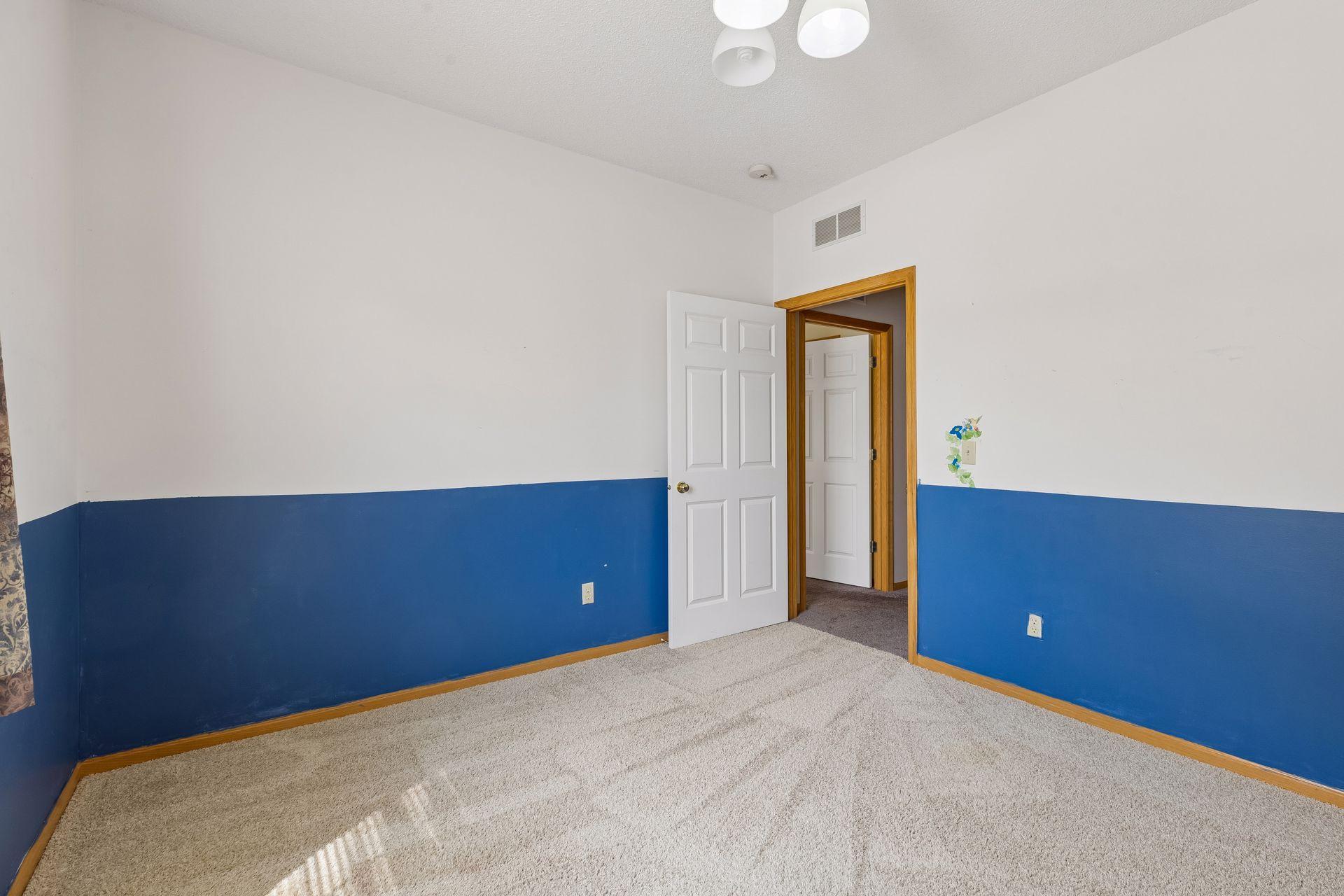 9 foot ceilings really help create volume. The doorway in the hall leads to the primary bedroom.