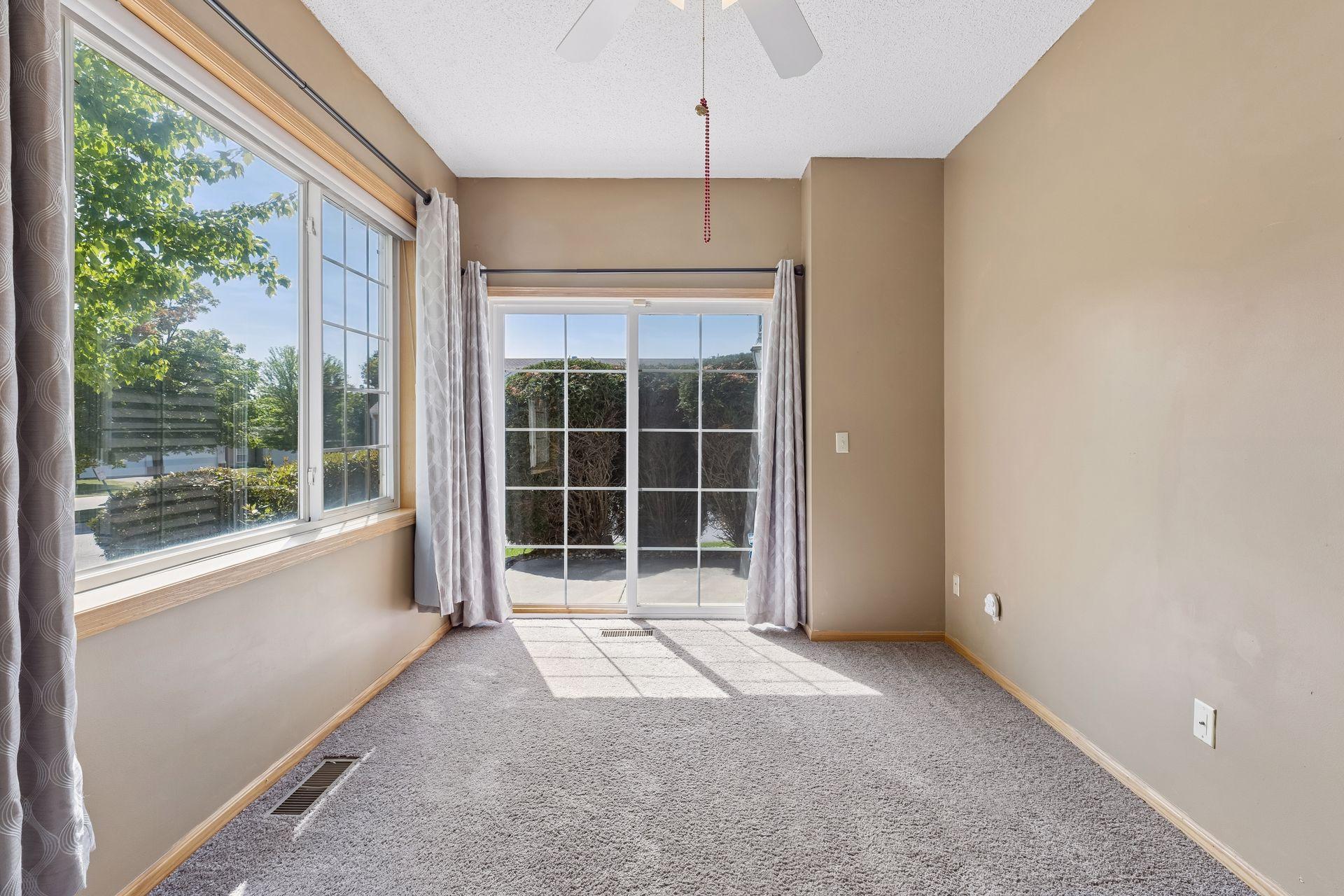 This room also has a large patio door leading to a SOUTH facing patio.