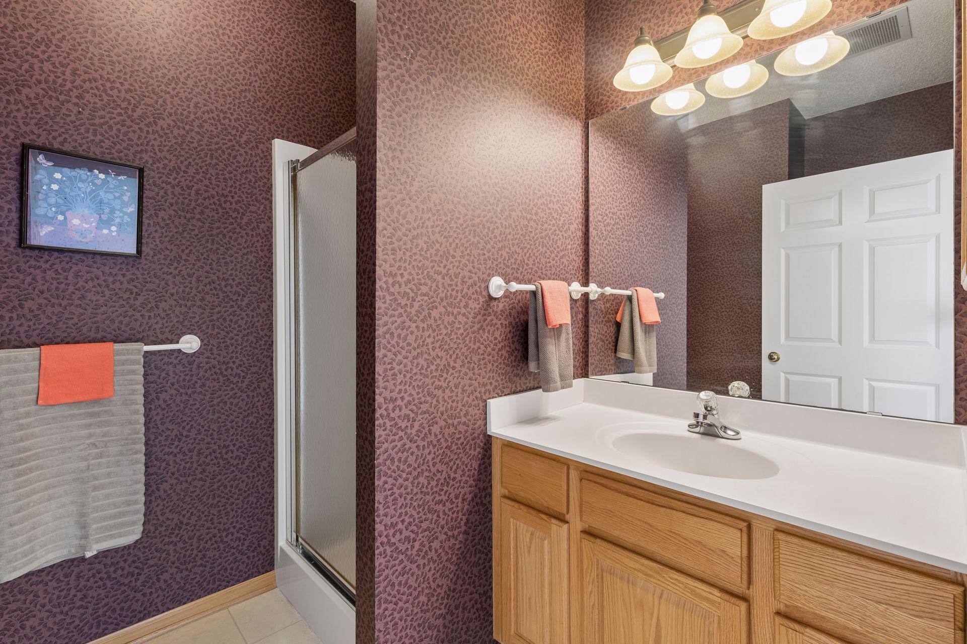 This 3/4 bath is for guests and it has a ceramic tile floor and shower.