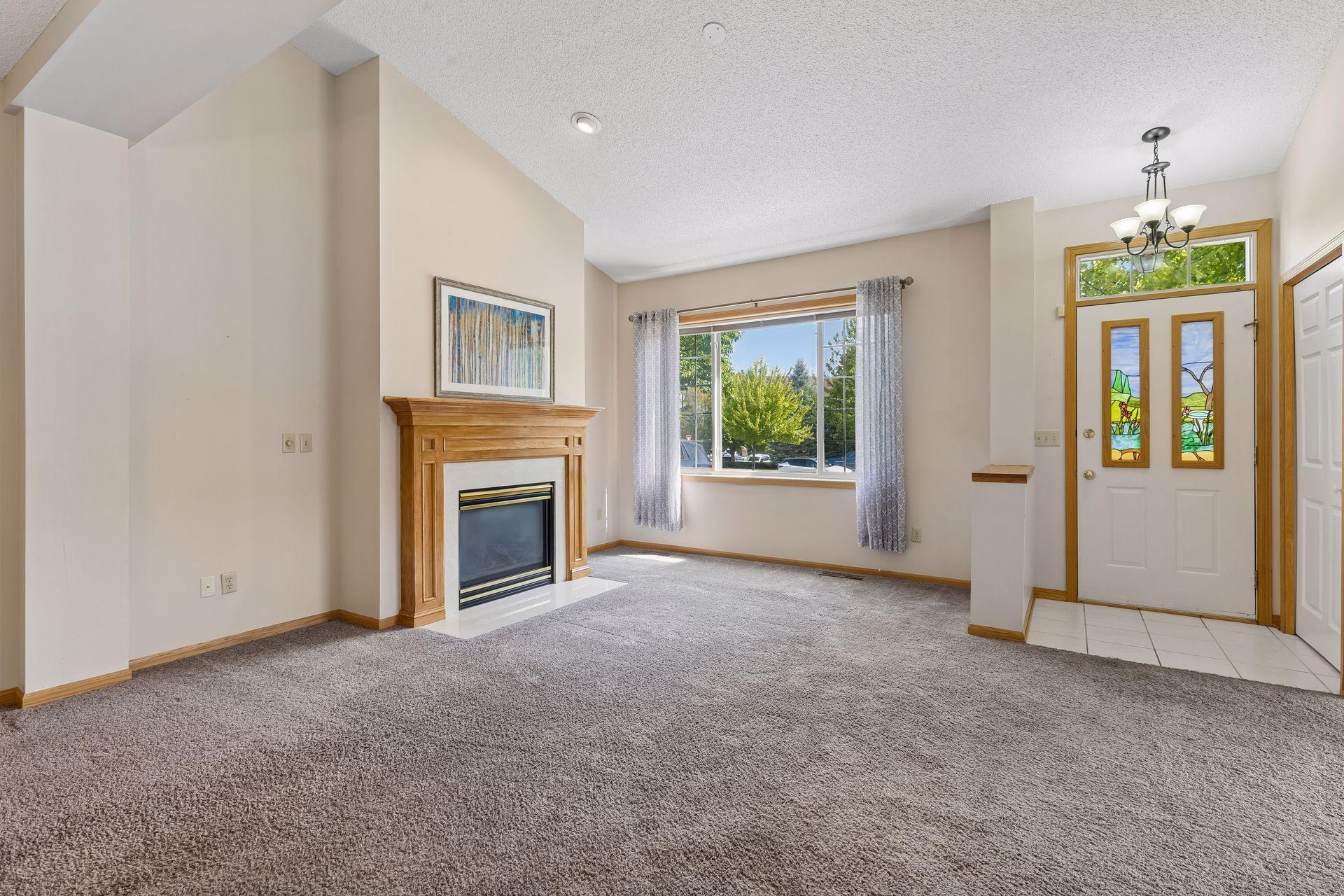 Soaring ceilings, a transom window above the front door, and a huge wall of windows lets in so much natural light.
