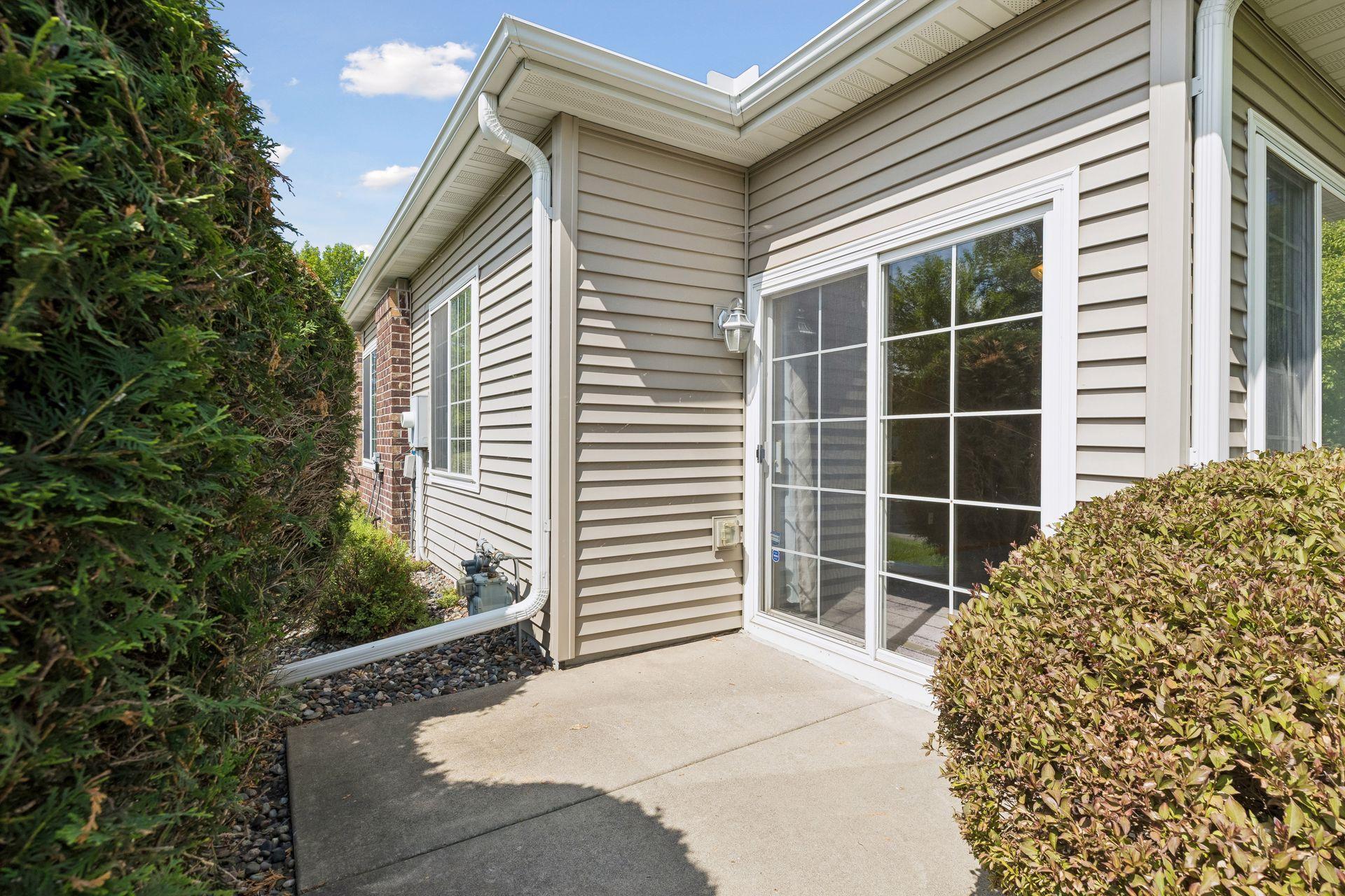 This is the patio -- mostly private with trees and shrubs. This townhome is an END UNIT!