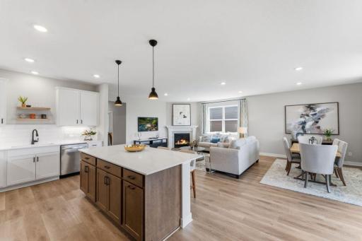 UPGRADED Signature Kitchen overlooking main living space and dining areas. *Photo of similar home with same floor plan