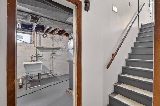 Entering the basement from the stairs off of the kitchen