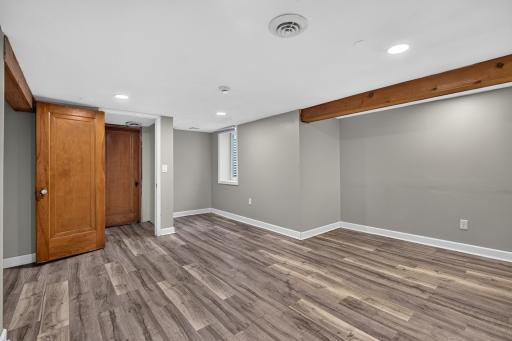 Egress window in the entertainment room and entry to storage rooms