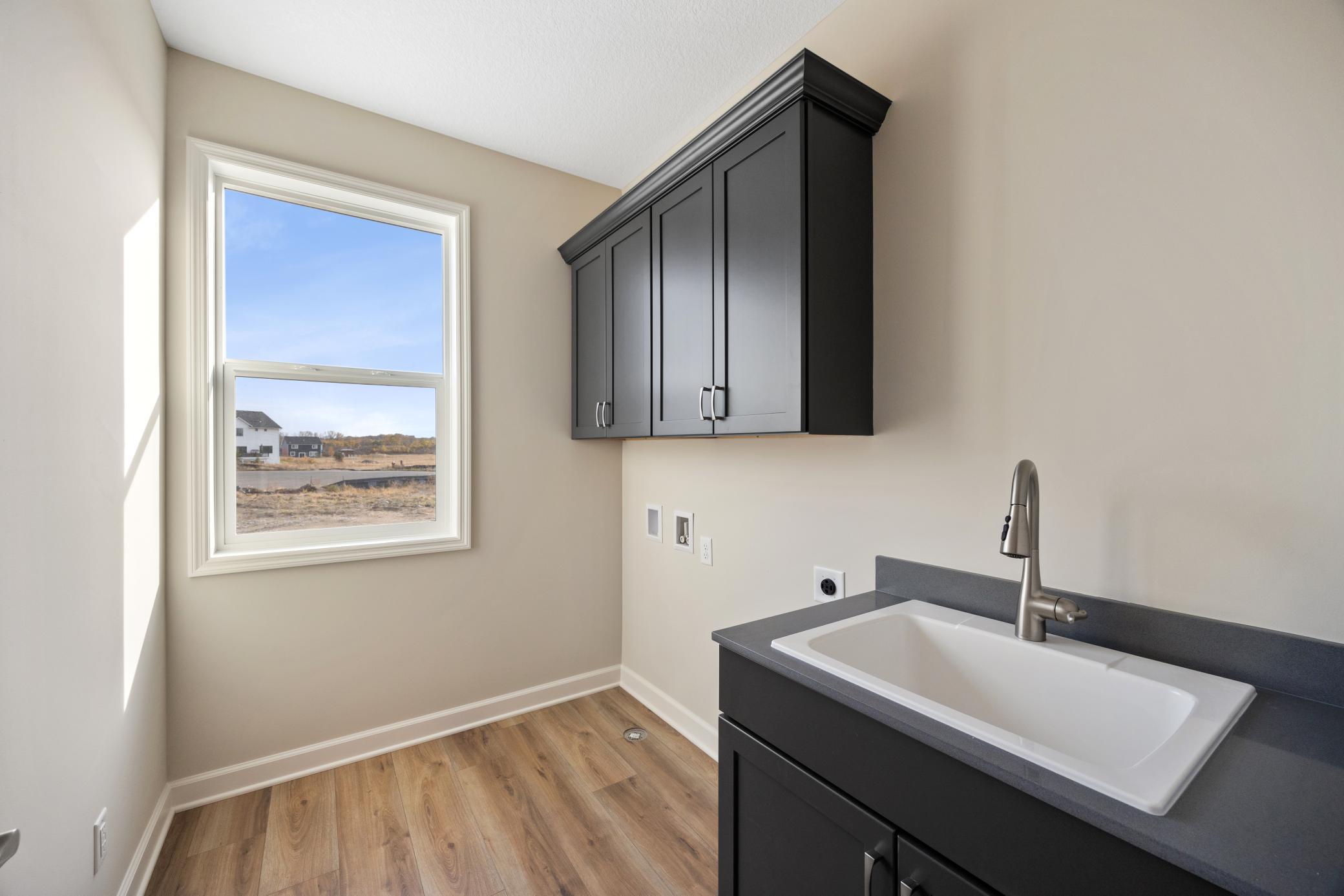 Main floor laundry with optional sink and cabinets
