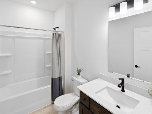 Full second bathroom showcases the functionality and layout of this space. Photo shown is from a previously built home; selections and finishes may vary.
