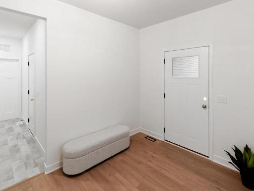 Spacious front entry offers plenty of room to welcome guests. Photo shown is from a previously built home; selections and finishes may vary.