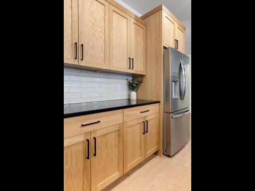 Additional cabinetry provides excellent kitchen storage and countertop space. Photo shown is from a previously built home; selections and finishes may vary.