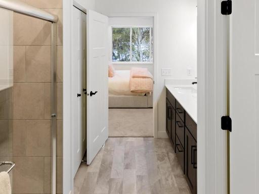 Thoughtfully designed primary suite connects the bedroom, private bath and walk-in closet for convenient one-level living. Photo shown is from a previously built home; selections and finishes may vary.