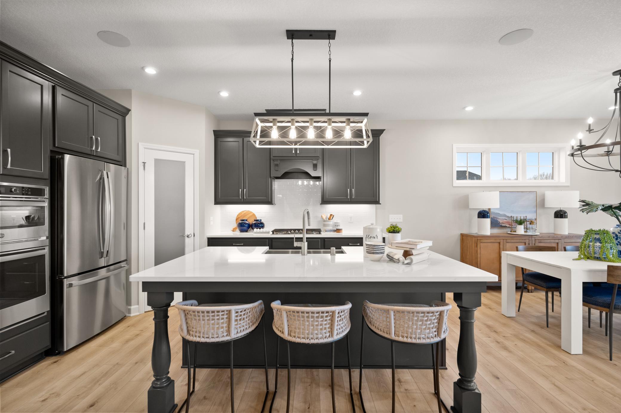 To Be Built The kitchen offers true eat in capabilities and is anchored by a large center island. (model photo)