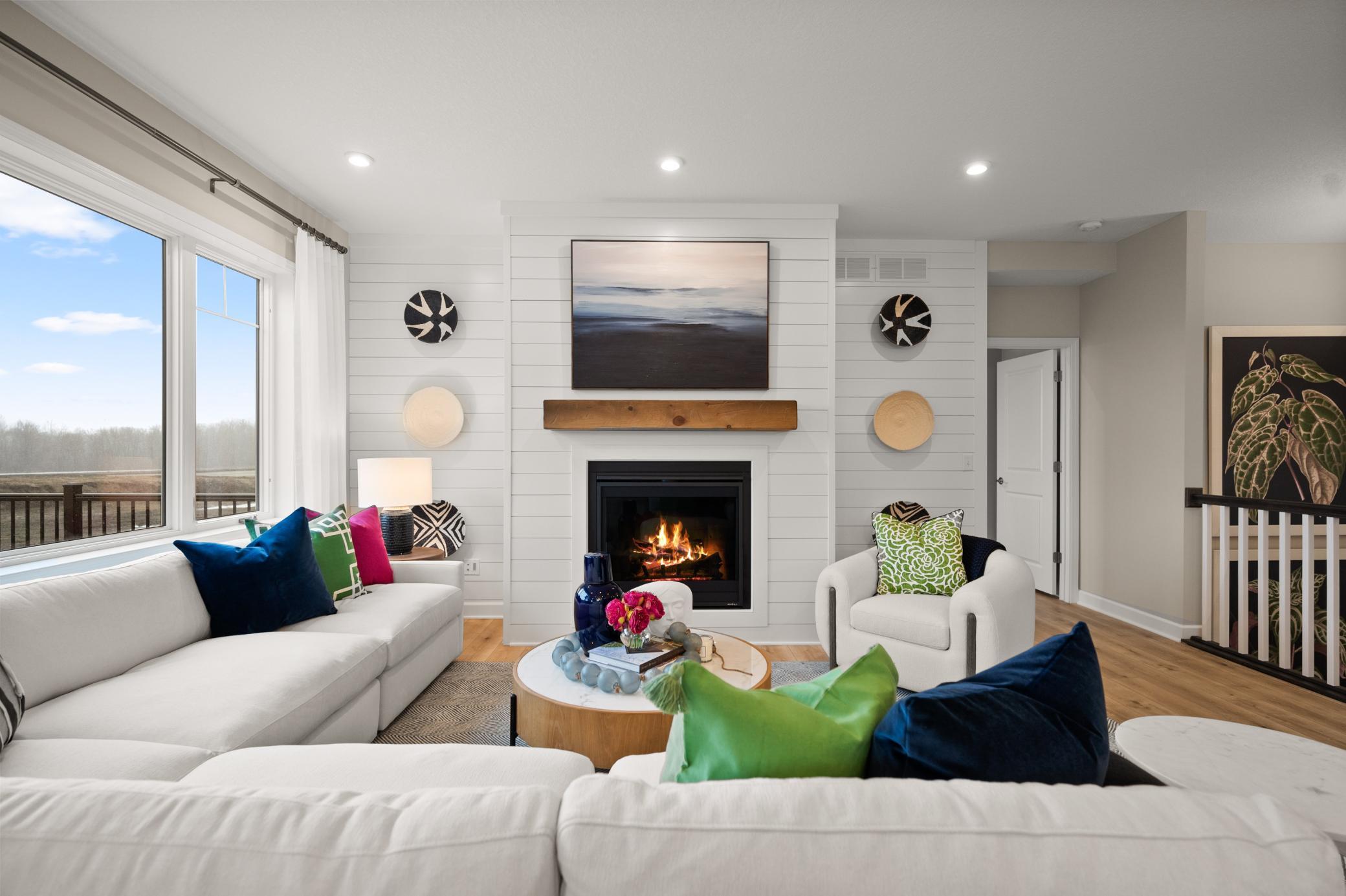 The main floor including the family room has several large windows for an abundance of natural light. (model photo)