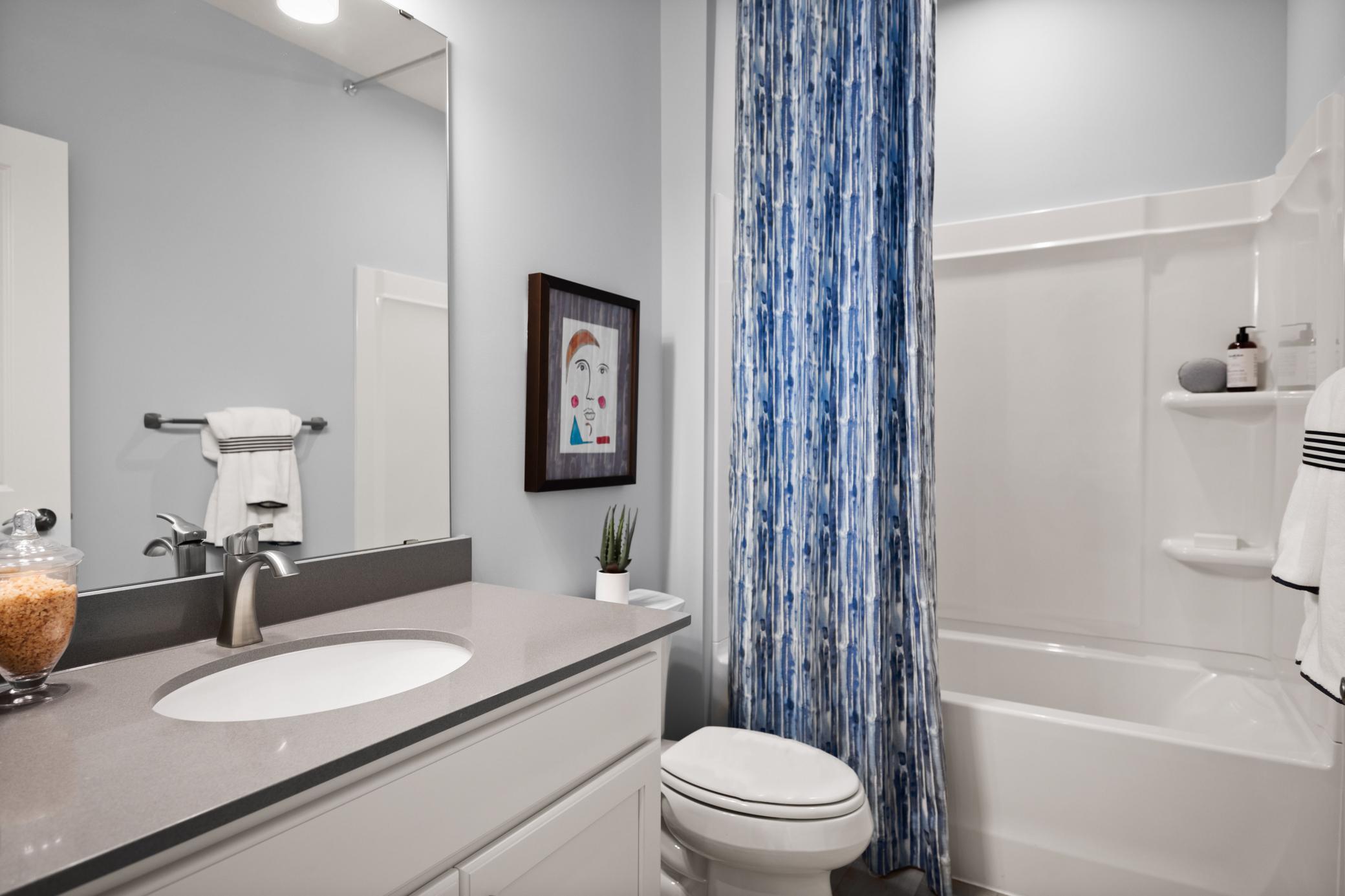 The main bath is perfect to service the second bedroom and the main level. (model photo)