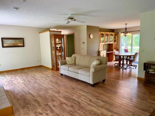 Open to dining room w/built-in cabinets