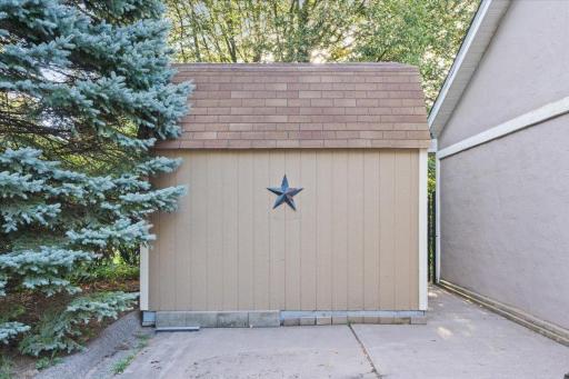 Shed on side of garage