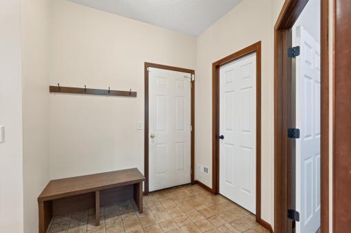 Garage Entry/Mudroom: Spacious walk-in entry from the garage with ample room for hanging coats, getting ready, and convenient walk-in closet storage.
