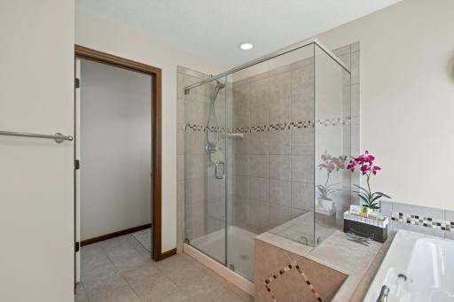 Primary Bath: Private primary bath featuring a relaxing jetted tub and separate walk-in shower.