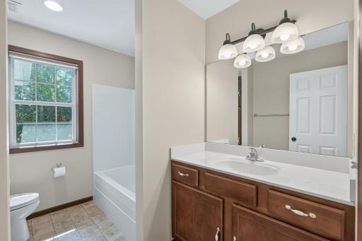 Upper-Level Bath: Convenient full bathroom serving the upper-level bedrooms.